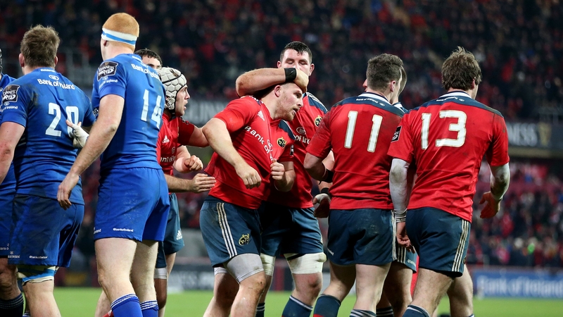 Munster's Andrew Conway celebrates his try with Paddy Butler