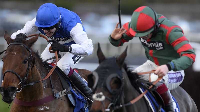 Aidan Coleman riding Emperor's Choice (left) en route to victory in the Welsh Grand National