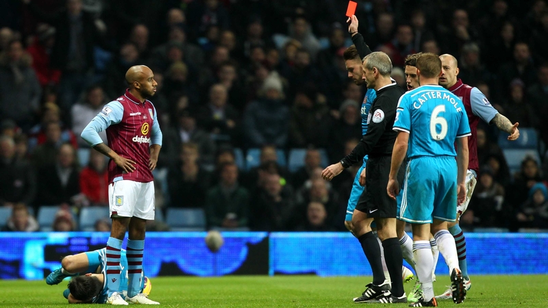 Fabian Delph sees red at Villa Park as Jordi Gomez lies prostrate behind the Aston Villa midfielder