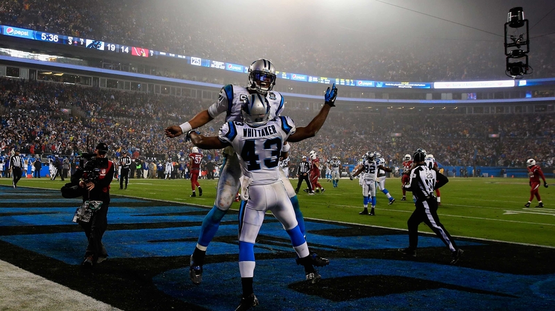 Cam Newton and Fozzy Whittaker celebrate a touchdown