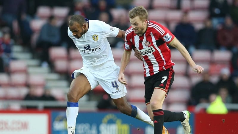 Leeds' Rudolph Austin (L) vies with Sunderland's Sebastian Larsson
