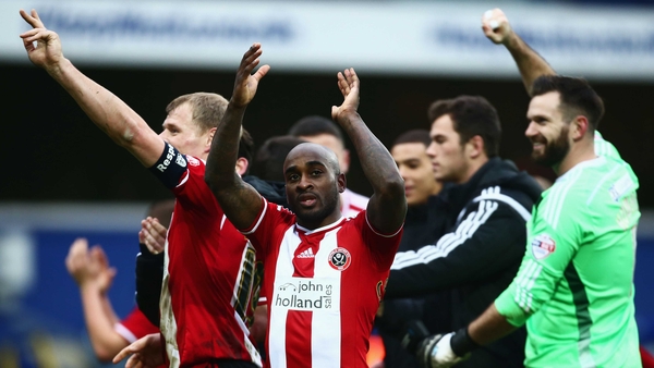 Jamal Campbell-Ryce of Sheffield United (C) celebrates victory with his team-mates