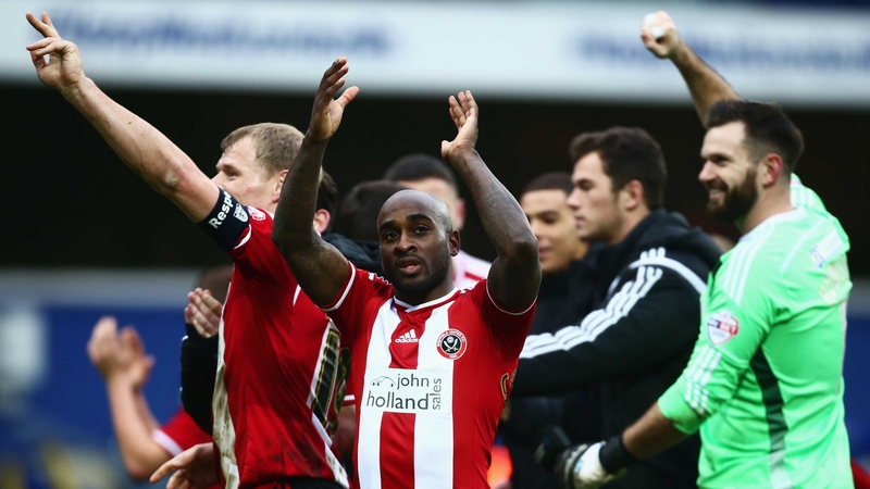 Jamal Campbell-Ryce of Sheffield United (C) celebrates victory with his team-mates
