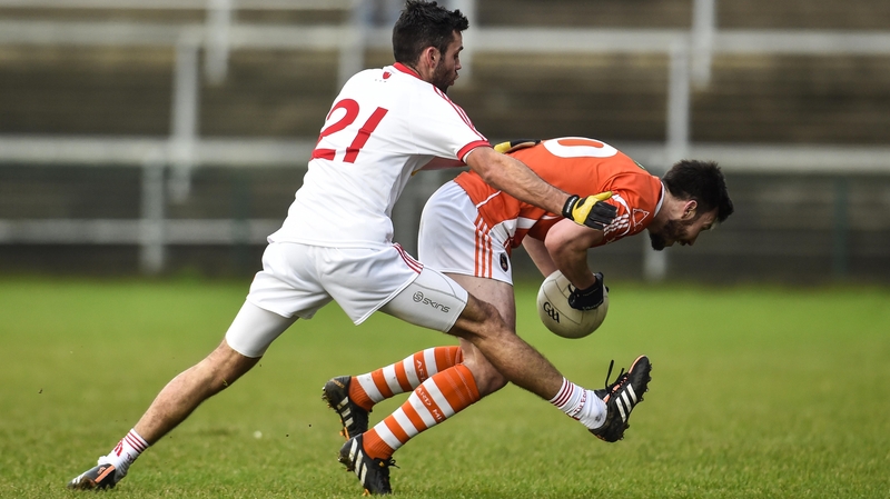 Tyrone's Emmet McKenna and Armagh's Stefan Forker compete for the ball