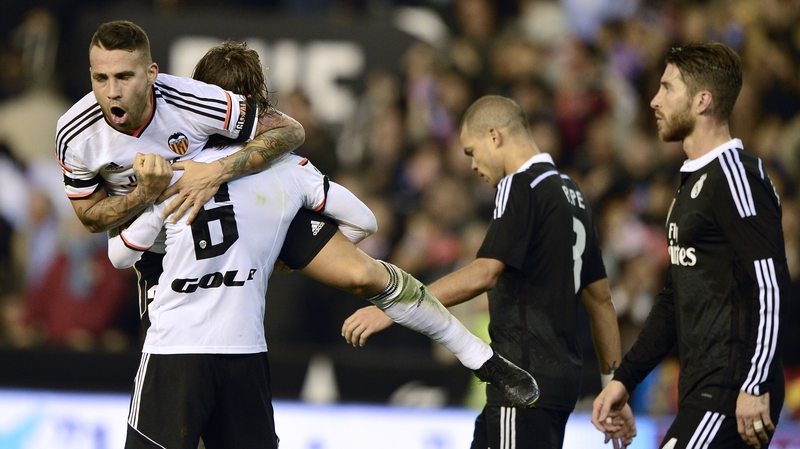 Valencia's Nicolas Otamnedi and Lucas Orban celebrate their victory
