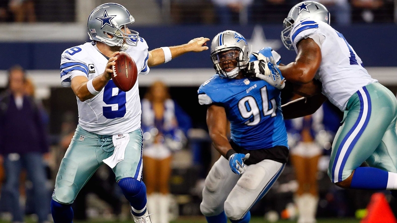 Tony Romo of the Dallas Cowboys is closed down by Ezekiel Ansah of the Detroit Lions