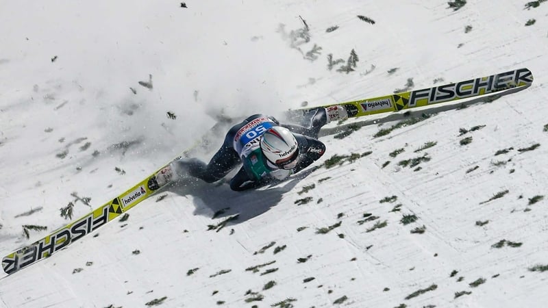 Simon Ammann suffers a high-speed fall in Bischofhofen