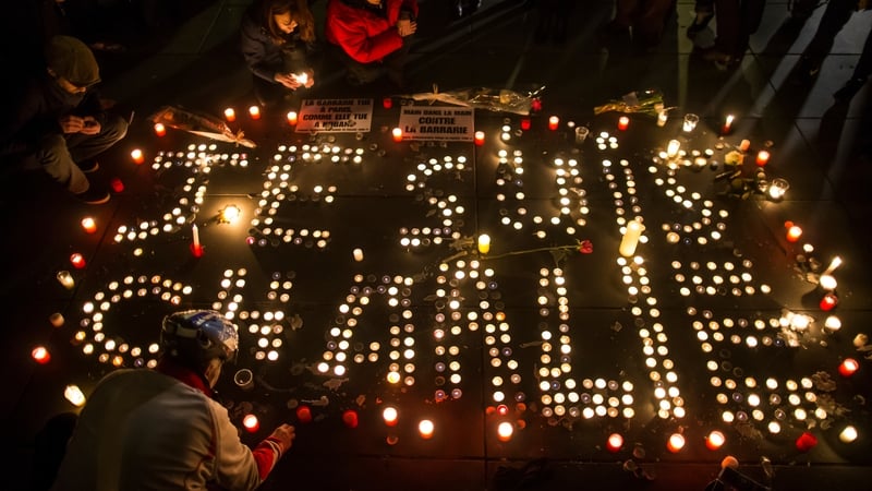 Candles are lit in Paris in memory of the 12 victims