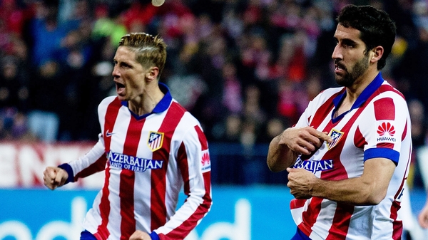Fernando Torres helps Raul celebrate his opening goal
