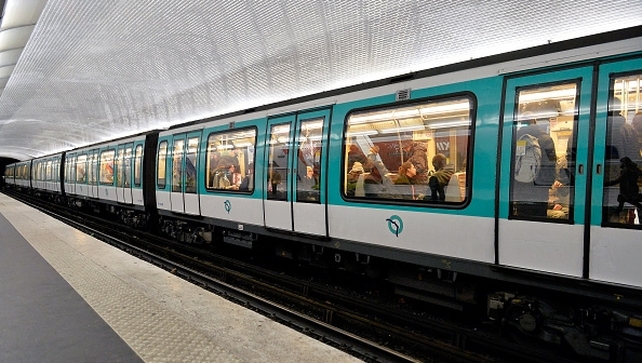People on a train observe a one minute's silence in Paris today