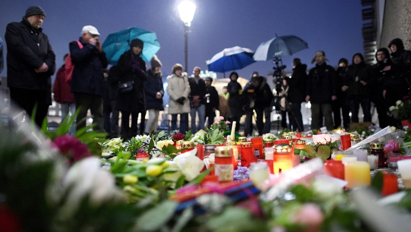 Mourners pay their respects to the victims of the attack on French magazine Charlie Hebdo outside the French Embassy, Berlin, Germany