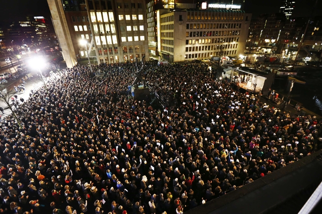 People in Rotterdam gather to pay their respects to the victims at 1940 Square, Rotterdam, Netherlands