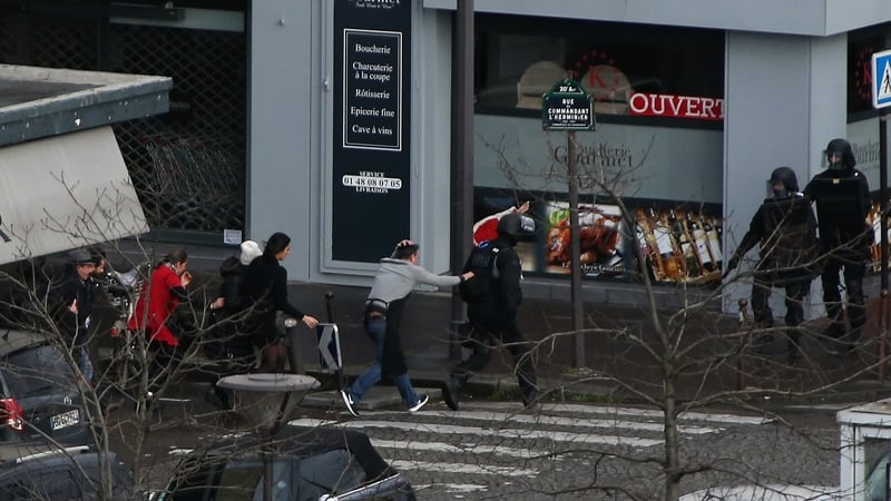 Police evacuate people from businesses close to the kosher store