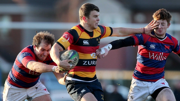 Clontarf's Ariel Robles and Evan Ryan chase Lansdowne's double try-scorer Tom Farrell