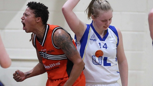Killester's Robin Murphy (left) celebrates scoring