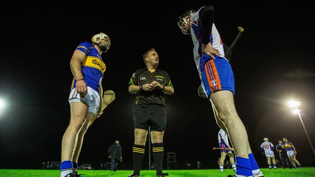 Tipperary's Paudie Maher and Declan Hannon of Mary I with referee Nathal Wall at the coin toss in their Waterford Crystal Cup game at Dr Morris Park