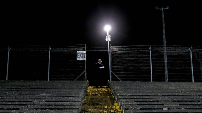 A spectator checks his program for the Meath vs DCU O'Byrne Cup game on in Navan