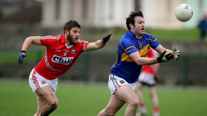 Cork's Eoin Cadogan in pursuit of Barry Grogan of Tipperary