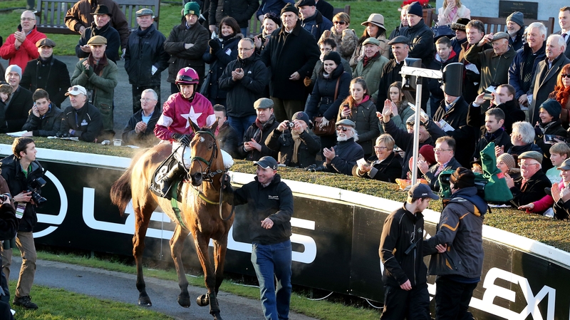 Jockey Bryan Cooper aboard Road To Riches after their Lexus Chase success
