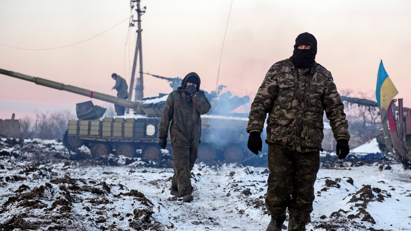 Ukrainian soldiers walking past tanks at a position in the Donetsk area earlier this year
