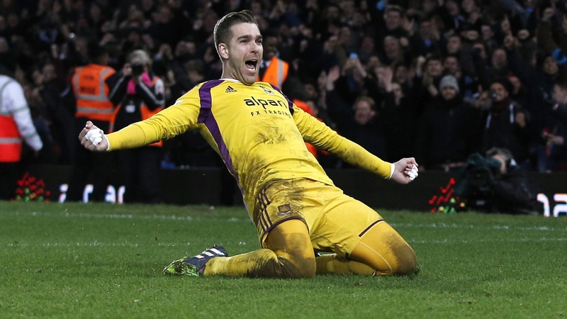 West Ham United's Spanish goalkeeper Adrian celebrates after scoring the winning penalty in the sudden death shoot-out