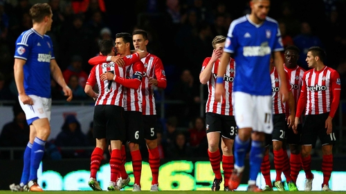 Shane Long is congratulated by his Southampton team-mates after scoring the winning goal
