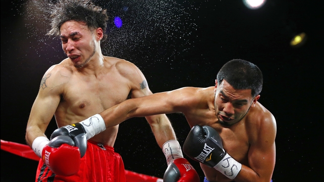 Rigoberto Miranda takes a right punch to the face by Eduardo Martinez in a Featherweight match