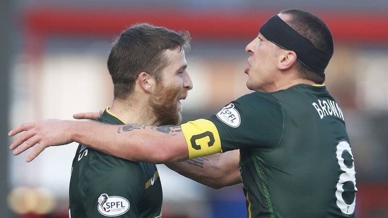 Adam Matthews celebrates his goal with bandaged team-mate Scott Brown