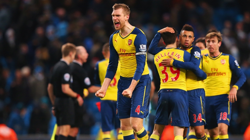 Arsenal's Per Mertesacker and his team-mates celebrate victory