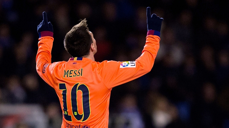 hat-trick man Lionel Messi celebrates scoring Barcelona's second goal at Deportivo