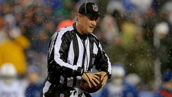 Umpire Carl Paganelli with one of the balls in question
