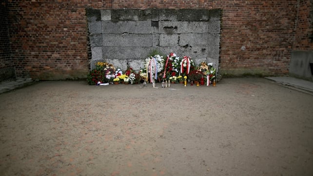 Floral tributes are regularly left at the execution wall at the Auschwitz I camp
