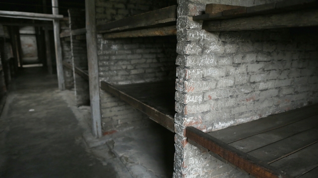 Prisoners bunks line the inside of a block at the Auschwitz II Birkenau extermination camp
