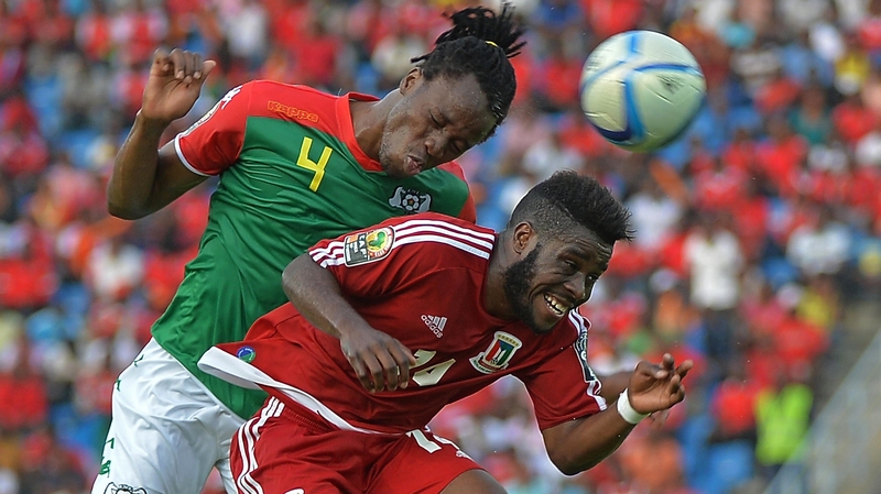 Burkina Faso's Bakary Kone (left) beats Equatorial Guinea's Kike to the ball in today's stalemate