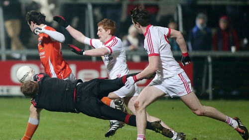 Tyrone goalkeeper Michael O'Neill blocks a goal-bound shot from Armagh's Jamie Clarke
