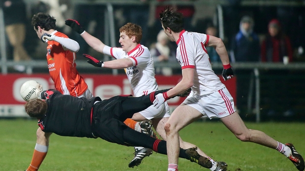 Tyrone goalkeeper Michael O'Neill blocks a goal-bound shot from Armagh's Jamie Clarke