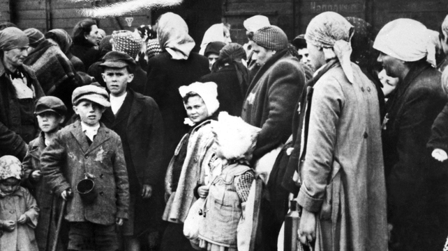 Women and children getting off trains at their arrival in 1943