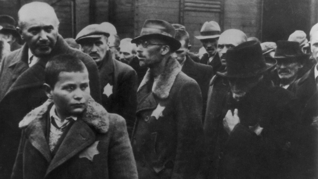 Jews, with the yellow stars sewn on their coats, arrive at the camp in 1944