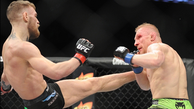Ireland's Conor McGregor kicks Dennis Siver of Germany during their UFC bout in Boston