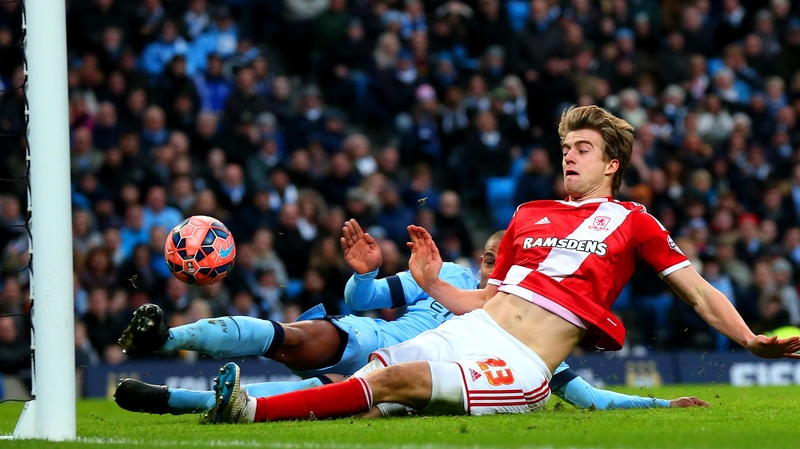 Fernando of Manchester City slides in and attempts to clear the ball but it rebounds off Patrick Bamford of Middlesbrough