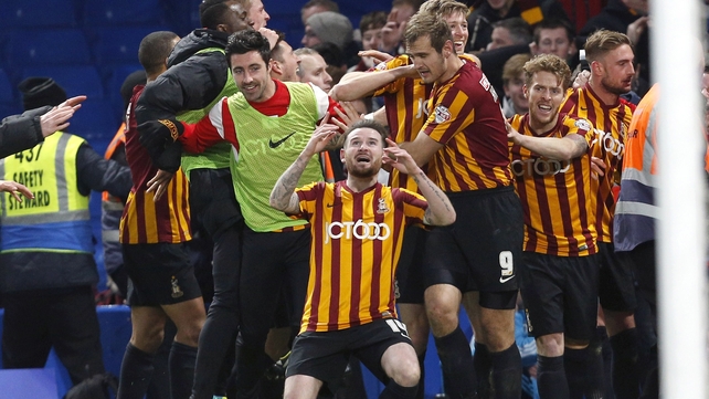 Bradford's Irish midfielder Mark Yeates drops to his knees after his side's remarkable FA Cup win against Chelsea at Stamford Bridge