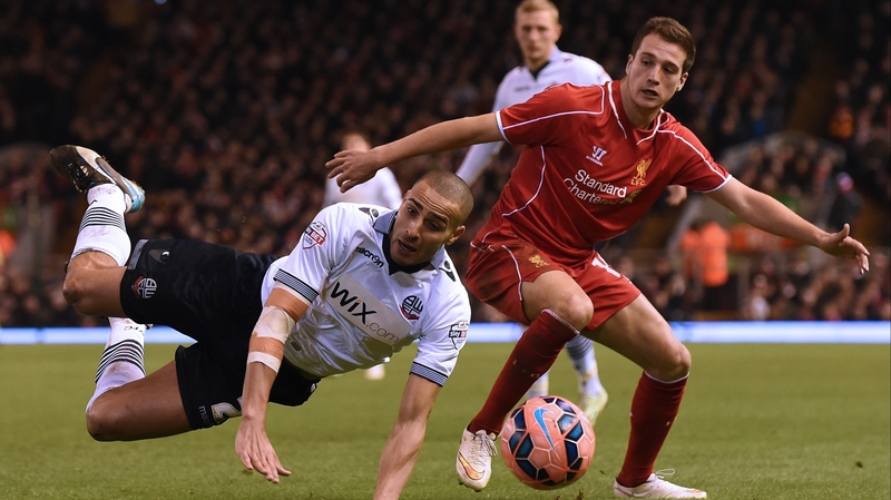 Darren Pratley of Bolton takes a tumble under a challenge from Javier Manquillo