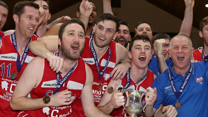 Demons players celebrate their National Cup triumph