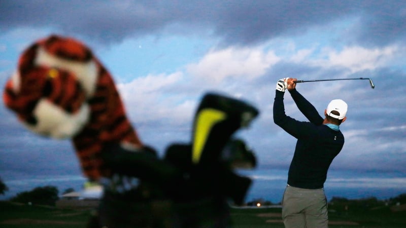 Tiger Woods hits a shot on the practice ground prior to the start of the Waste Management Phoenix Open at TPC Scottsdale