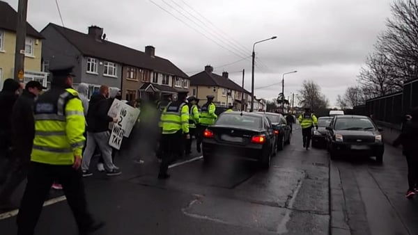 The President was heckled when he arrived and left Coláiste Eoin last Friday