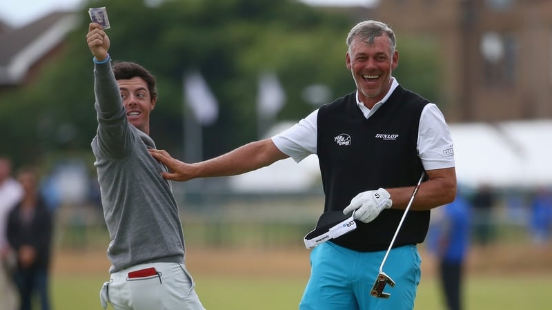 Friends Rory McIlroy and Darren Clarke share a joke at the 2014 Open Championship in Hoylake