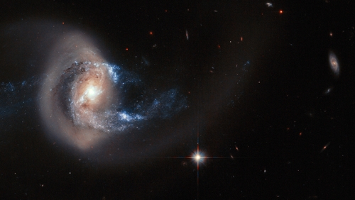 NGC 7714 is situated 100 million light-years from Earth - relatively close in cosmic terms