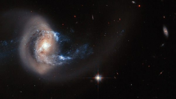 NGC 7714 is situated 100 million light-years from Earth - relatively close in cosmic terms