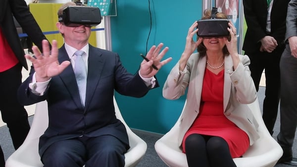Enda Kenny and Joan Burton try on virtual reality goggles as they launch the Action Plan for Jobs