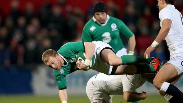 Keith Earls is tackled by England Saxons